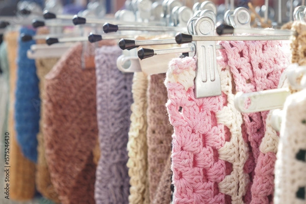 Fototapeta Colorful crochet pieces displayed at a local market