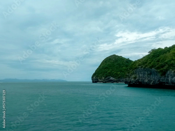Fototapeta Beautiful Seascape with Mountains, Blue Ocean, and Islands under Clear Sky at Ang Thong National Marine Park, Koh Samui, Thailand