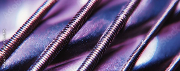 Obraz Abstract composition of metallic screws with vibrant reflective surfaces under dramatic lighting