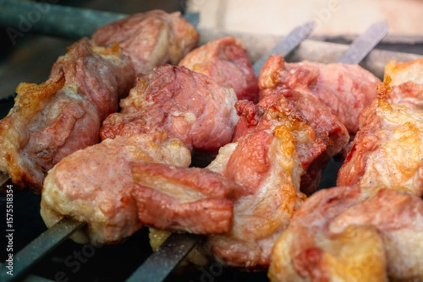 Obraz Close up grilling barbecue in the campground at summer camp travel, Skewers of pork and beef fillet on barbecue party dinner in camping, Summer Camp Travel one activity for relaxing.