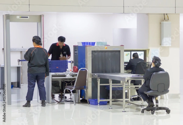 Fototapeta Security gates with metal detectors and scanners at entrance of airport