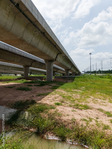 Obraz Highway interchange crossing over green farmlands in Thailand