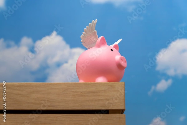 Obraz A pink pig with small white wings. Represents the idiom "when pigs fly," signifying something highly improbable or impossible.