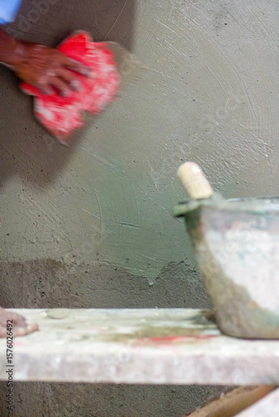 Obraz Workers plastering walls with plastic scrap