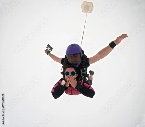 Obraz A tandem skydive into the clouds	