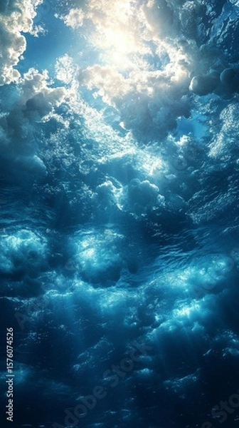 Fototapeta Sunlight Piercing Through Ocean Water with Clouds Reflection