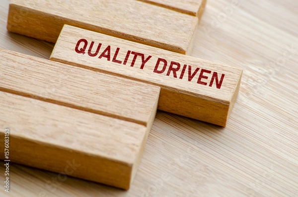 Fototapeta Quality Driven text on wooden blocks. Business and Quality control concept
