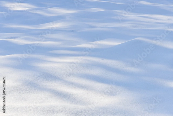 Fototapeta Fresh sparkling wavy snow snowdrifts close-up, perfect as a winter season background or texture