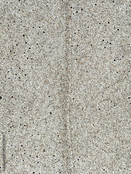 Fototapeta Sand on the Baltic Sea beach in Mrzezyno in Poland after being washed by a wave in close-up as a background