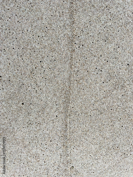 Fototapeta Sand on the Baltic Sea beach in Mrzezyno in Poland after being washed by a wave in close-up as a background