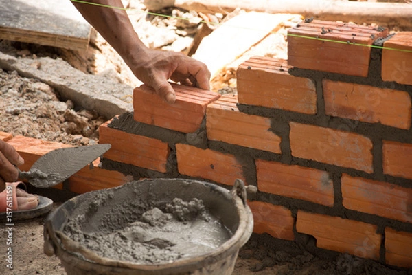 Obraz Workers are brick Building wall
