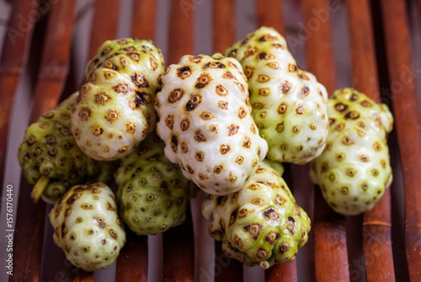 Obraz Exotic Noni Fruits Beautifully Arranged on a Rustic Wooden Surface for an Appealing Look