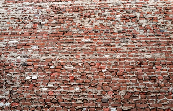 Obraz Weathered and Worn Vintage Red Brick Wall in the Honolulu Chinatown District.