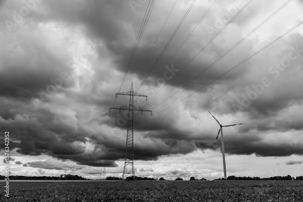 Obraz Das Windrad neben dem Strommast