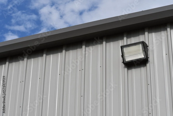 Obraz Floodlight on metal building.