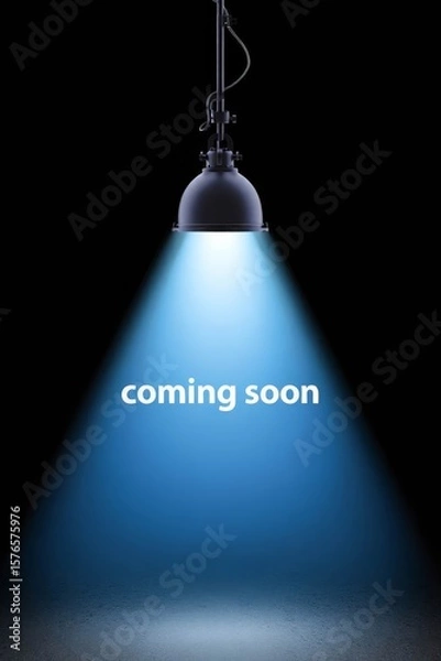 Obraz Spotlight shining on dark background with coming soon text.