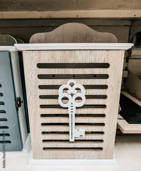 Fototapeta A wooden box with a key on it