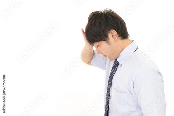 Obraz 落ち込む男性