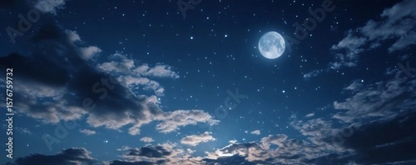 Obraz A celestial night sky with a full moon and clouds.