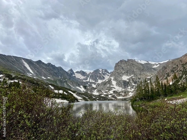 Obraz Panoramic view of snowy mountains of hike in Lake Isabelle in Colorado with storm clouds