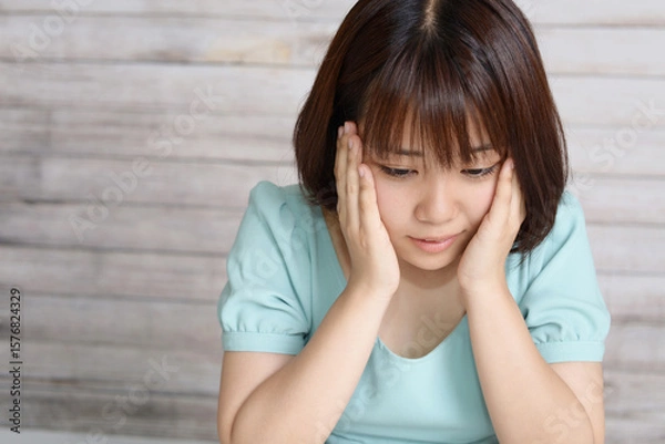 Obraz 困った表情の女性