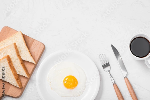 Fototapeta Traditional breakfast with fried eggs on a plate