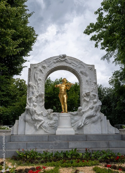 Fototapeta Front side photo of the Johann Strauss monument at Vienna, Cloudy sky at the background.