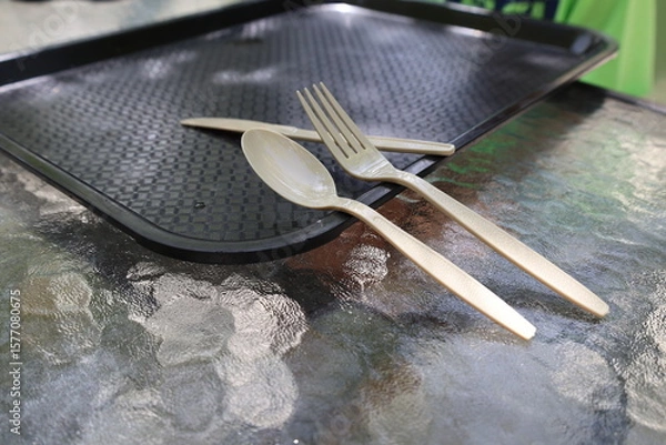 Fototapeta fork spoon and knife plastic set of disposable tableware and tray