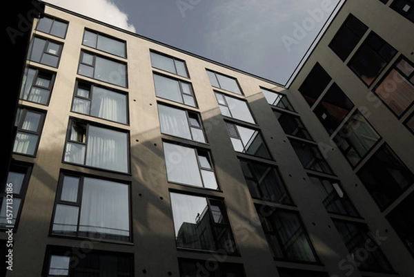 Fototapeta The modern urban architecture is characterized by its stunning reflective glass facades