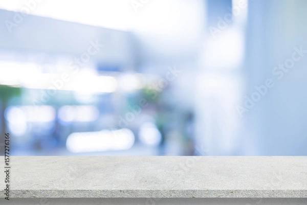 Fototapeta abstract blurred interior of entrance of hospital background with concrete texture tabletop for show and promote content or product on display
