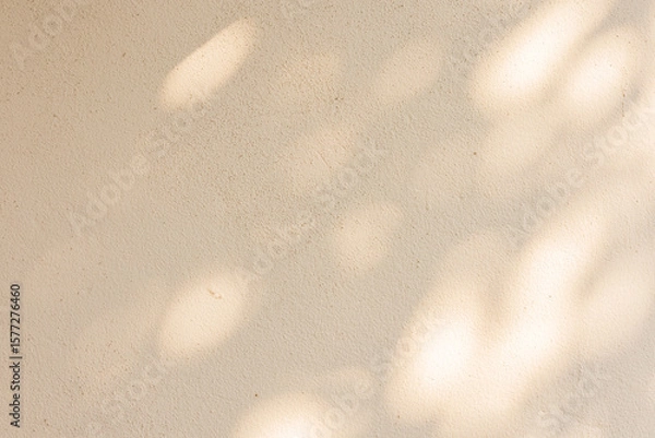Fototapeta close up on beige plain wall background texture with shadow of window from sunlight for ads and advertisement product such as cosmetic or content or goods design display concept