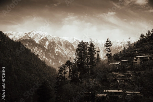 Obraz Small Village with Snowy Mountain in Background