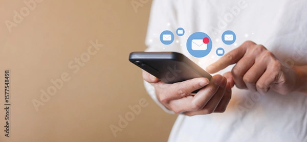 Fototapeta close up businessman holding smartphone and checking email online on web with virtual interface technology concept