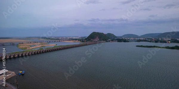 Fototapeta Aerial panoramic view of historic Prakasam barrage on the Krishna river during evening time at Vijayawada, India