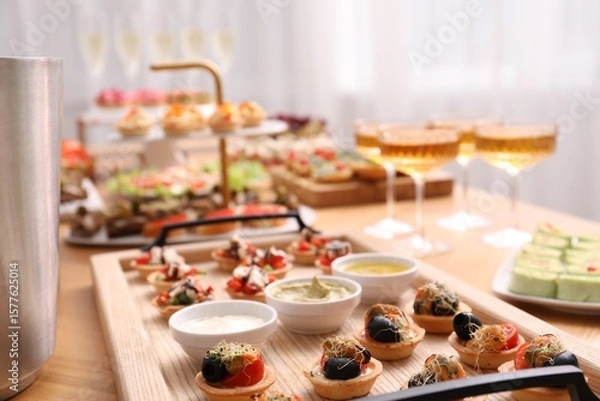 Fototapeta Buffet menu. Many different appetizers on table, closeup