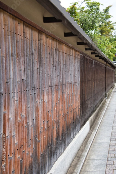 Fototapeta A view of the old-fashioned wall made with bamboo.  Kyoto Japan
