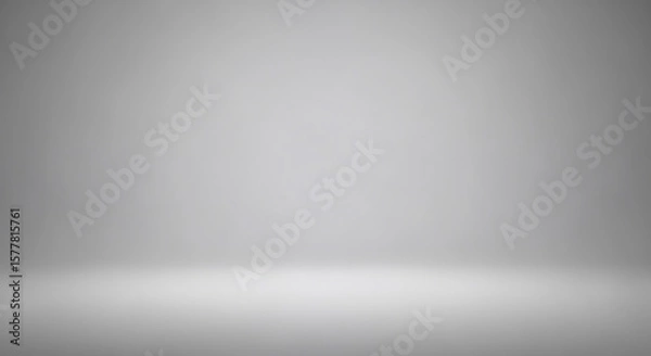 Fototapeta A plain grey gradient studio background with soft lighting. Ideal for product displays, presentations, or clean design elements