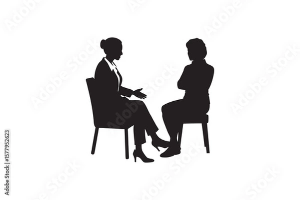 Obraz Silhouette of two women in a meeting one gesturing while the other listens attentively with arms crossed isolated on a white background