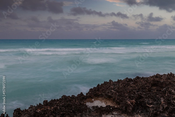 Fototapeta Sunset on the sandy beach of the Atlantic Ocean.