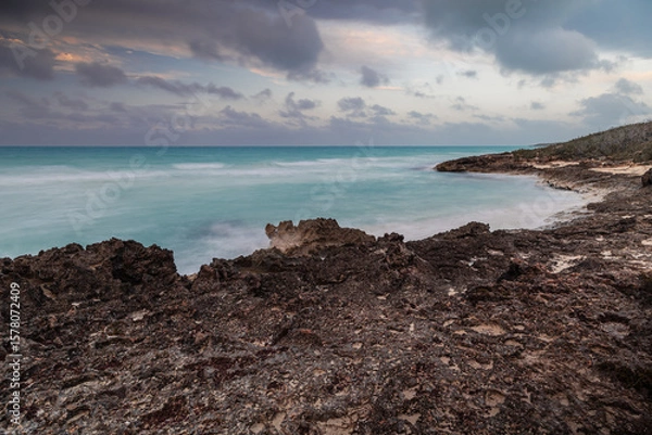 Fototapeta Sunset on the sandy beach of the Atlantic Ocean.