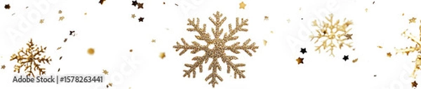 Fototapeta Golden snowflakes and stars scattered across a transparent background