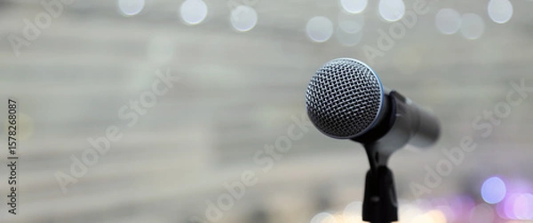 Fototapeta Close-up microphone for press conference speaker reports interview concepts or broadcasting public speaking speech presentation stage performance and reporter news with empty copy space background.