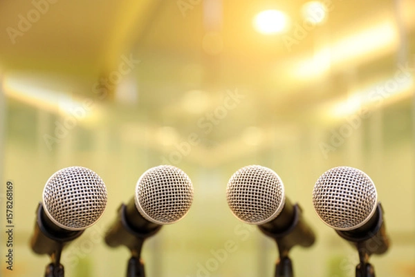Fototapeta A lot of microphones on stand for press conference speaker reports interview or broadcasting public speaking speech presentation stage performance and reporter news.
