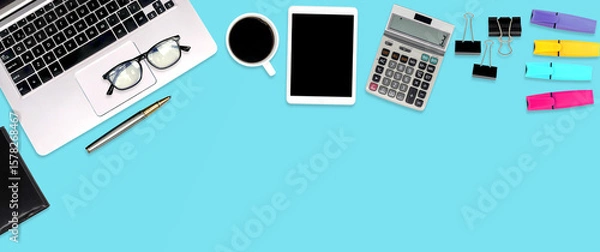 Fototapeta Top view desk office workspace with equipment on empty copy space for freelance working productive workplace area or home office flat lay background.