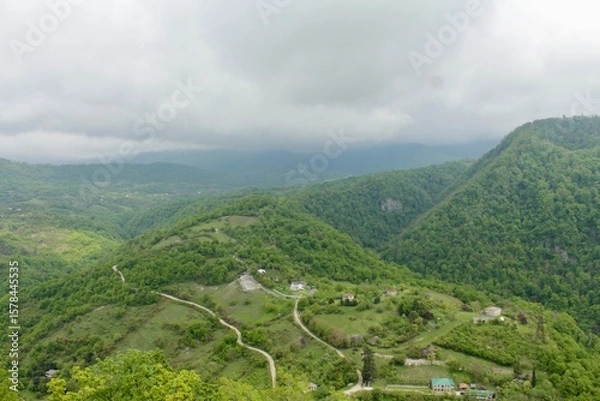 Fototapeta Beautiful view of the mountains in cloudy weather from above. Picturesque mountain landscape.