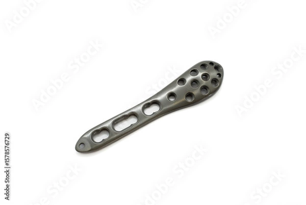 Fototapeta A Distal fibula lateral Plate isolated on the white background. Olecranon plate is used to fix a fractured a ankle bone joint.