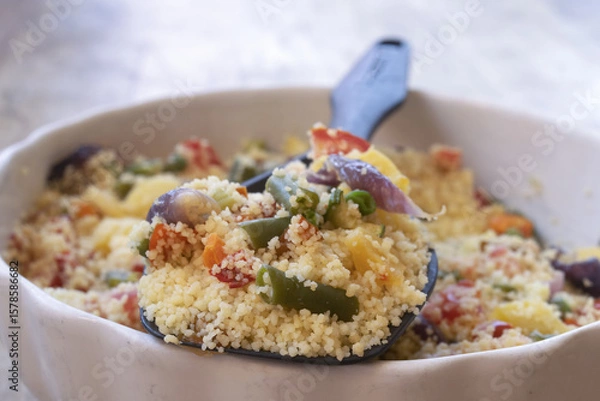 Fototapeta vegetarian couscous salad with roasted vegetables in ceramic bowl