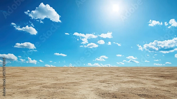 Fototapeta Vast, empty landscape with clear blue sky and scattered clouds, evoking sense of tranquility and openness