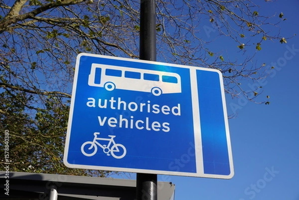 Fototapeta Authorised Vehicles signpost on road used by buses and cycles only.