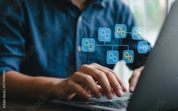 Fototapeta Man using laptop with process automation flowchart business workflow optimization and digital transformation for efficiency and productivity